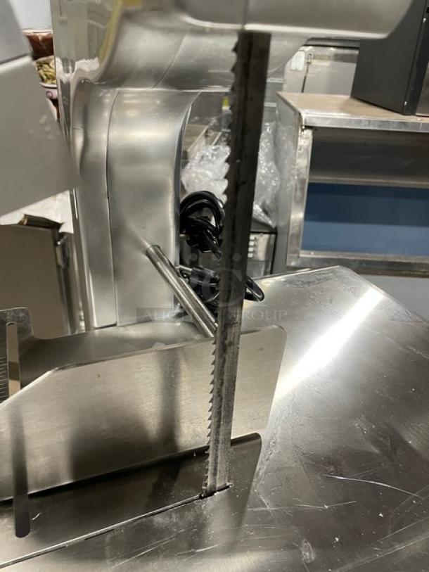 Universal HLS1650A electric bone saw, polished anodized aluminum, countertop model, heavy duty, on legs, 110V 1 phase.