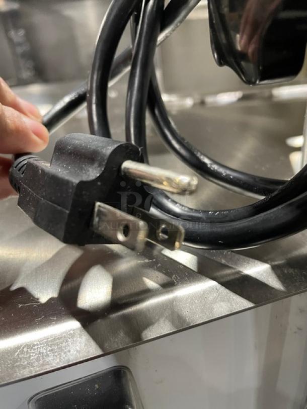 Universal HLS1650A countertop bone saw, electric 110V, polished anodized aluminum, heavy-duty, on legs. Model SN: 25HL7209-121.