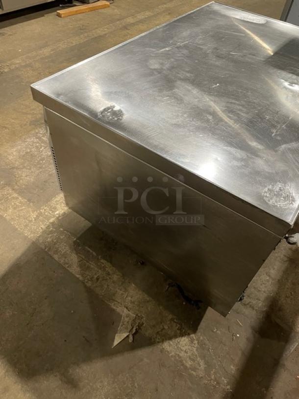 Continental stainless steel 2-drawer refrigerated chef base on casters. Commercial grade, sturdy, with some surface wear.