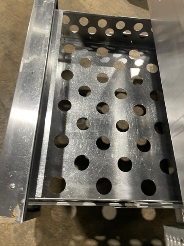 Continental stainless steel refrigerated chef base, two drawers, on casters, perforated interior, commercial-grade.