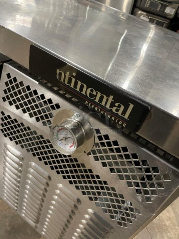 Continental 2-drawer stainless steel refrigerated chef base, in good condition, with temperature gauge and casters.