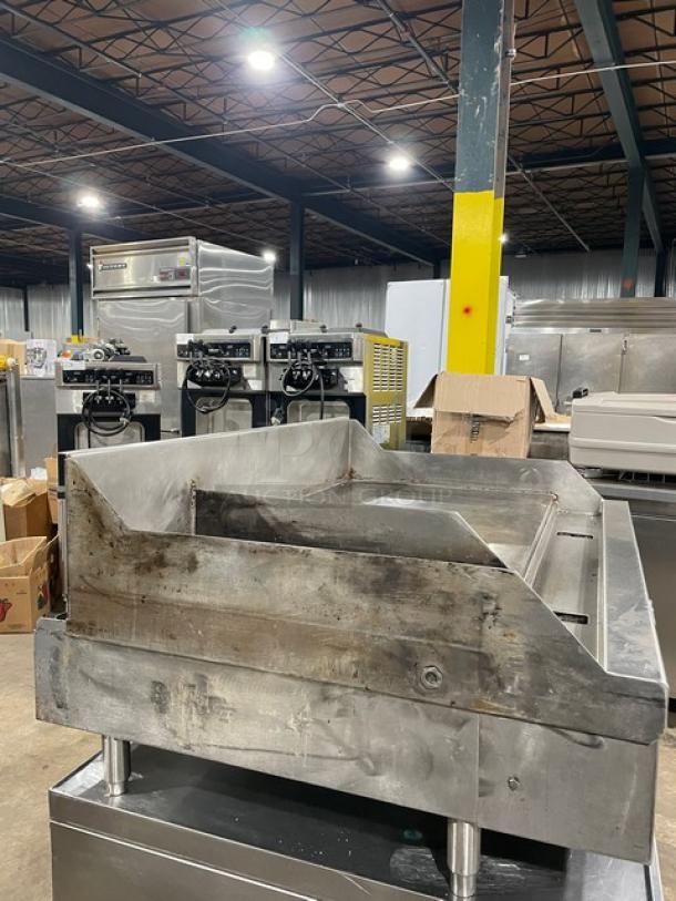 WoodStone stainless steel gas-powered plancha flat griddle, with split-top, back & side splash, on legs, used condition.