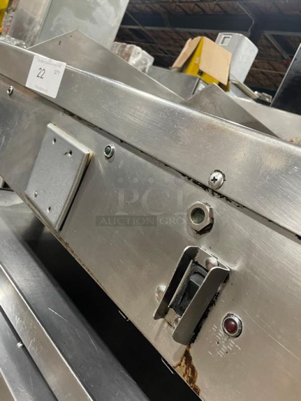WoodStone stainless steel gas-powered split-top plancha griddle with back and side splash, on legs, used condition.