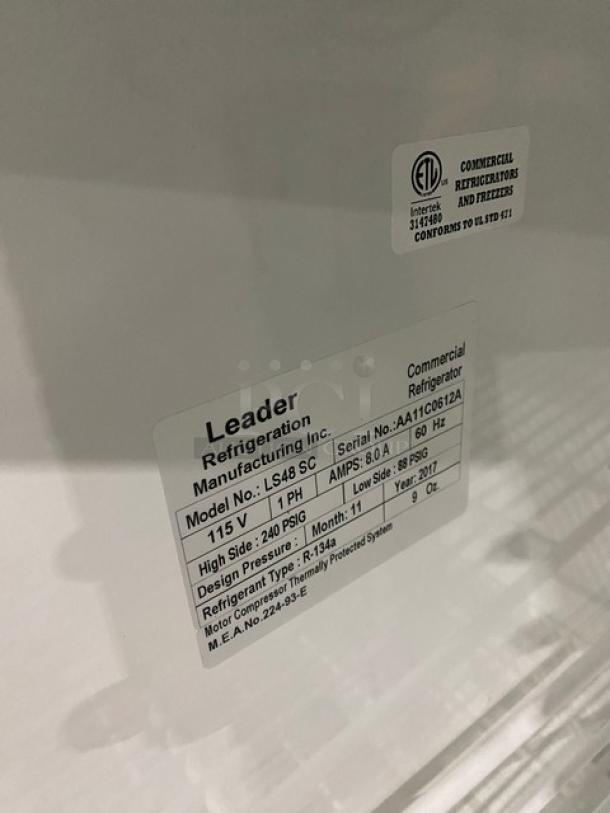 Leader Commercial Double Swing Door Reach-In Merchandiser Refrigerator, model LS48SC, features poly-coated wired rack, 115V, 1 Phase, serial number AA11C0612A.