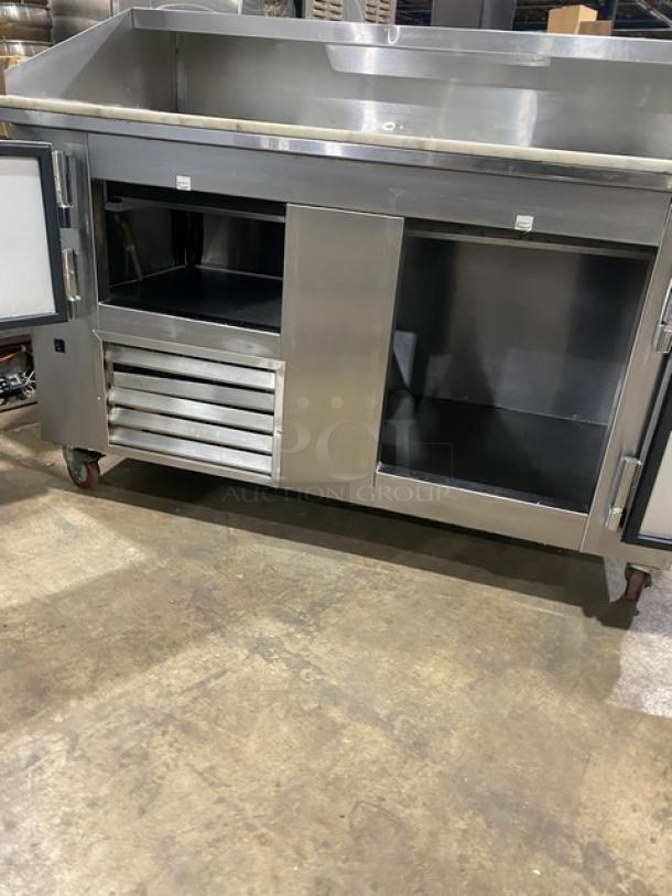 Leader DR60SC stainless steel 2-door refrigerated pizza prep table with marble worktop, overhead shelf, on casters.