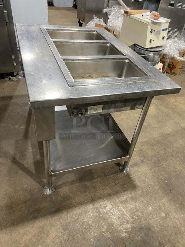 Wells MOD300TDM 3-well stainless steel steam table, thermostatic controls, single undershelf, on legs, 208/240V.