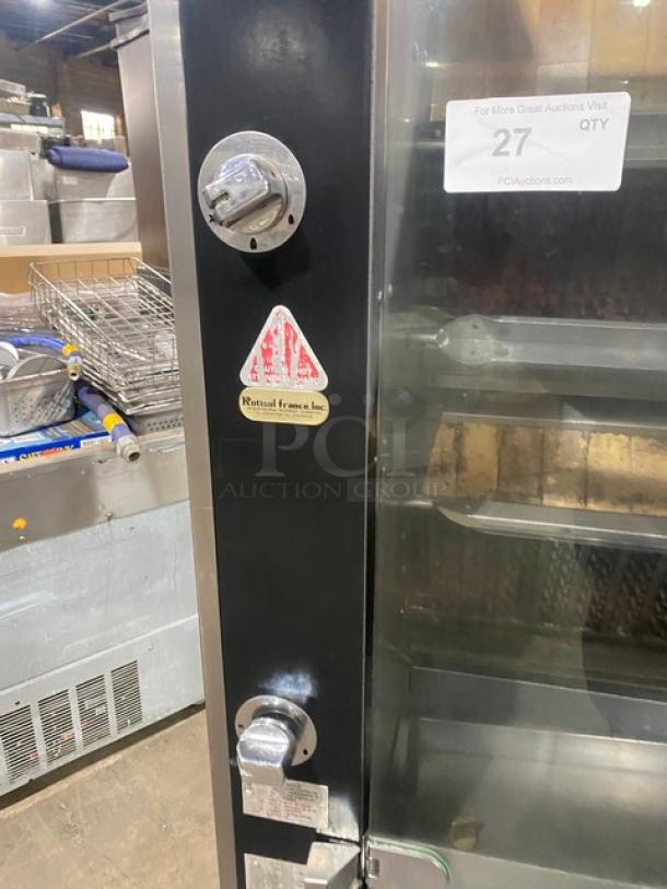 Rotisol commercial stainless steel rotisserie oven, model 9505, with tempered glass doors, cabinet base, and pull-out workstation.