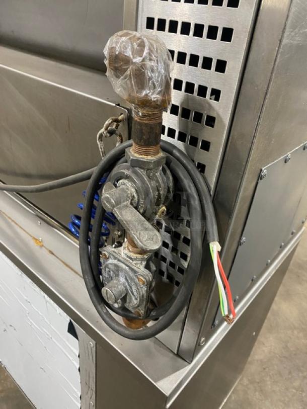 Rotisol Model 9505 rotisserie oven, stainless steel, natural gas, with wiring and unfinished connections on the side panel.