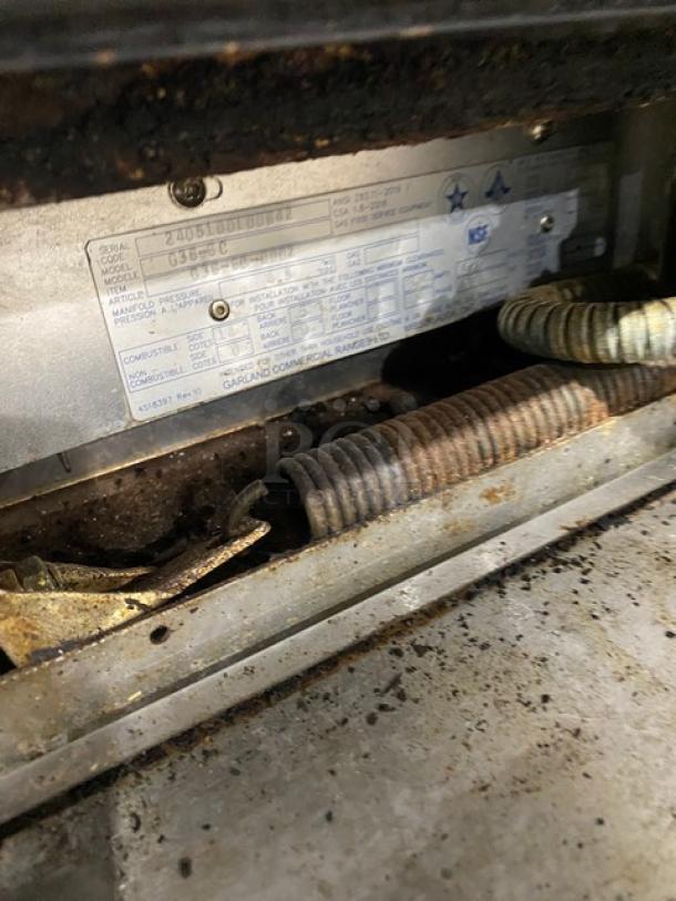 Garland G366C commercial gas range label, showcasing model and serial number. Worn but legible.