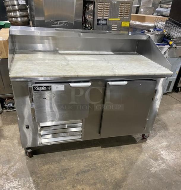 Leader DR60SC stainless steel 2-door refrigerated pizza prep table with marble worktop, overhead shelf, and casters.