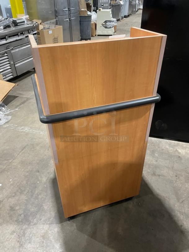 Commercial wooden enclosed recycle-style waste receptacle with upper serving tray storage, on legs, in good condition.