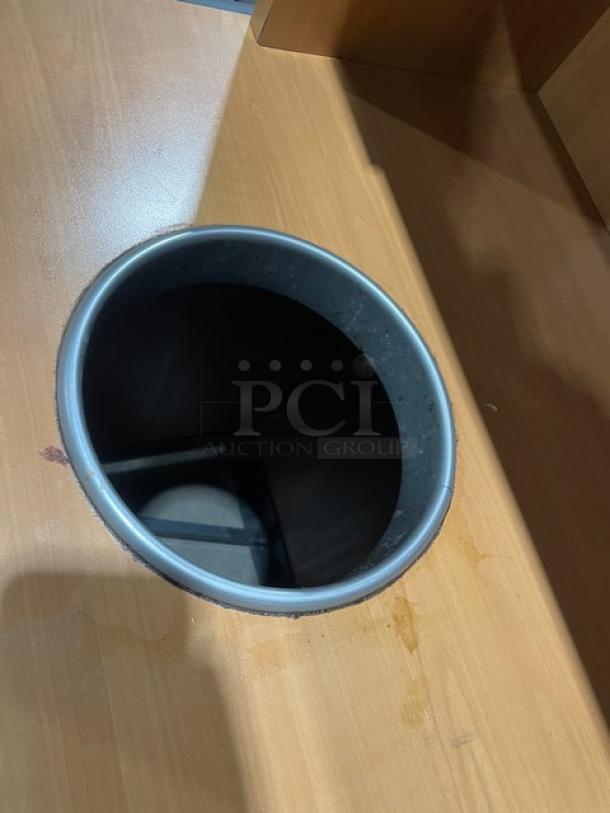 Commercial wooden recycle-style trash receptacle cabinet with upper tray storage, enclosed design, on legs, good condition.