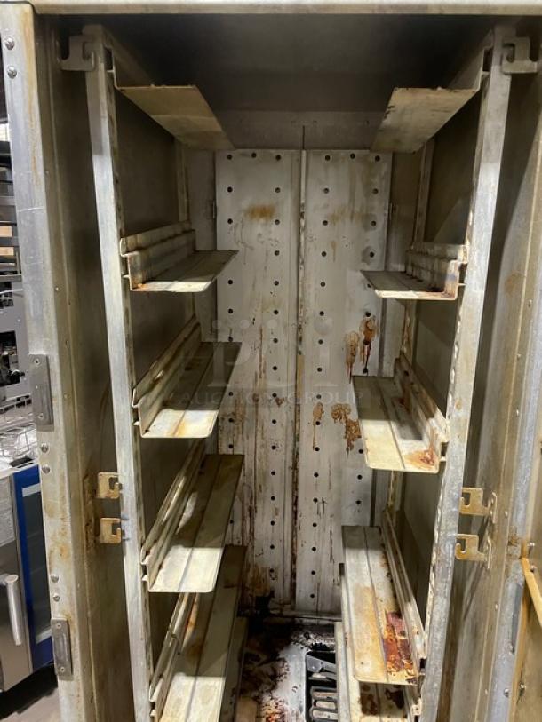 Metro Flavor Hold Series insulated mobile heated cabinet, Model C199H1N, wide pan slides, visible wear and rust, on casters.