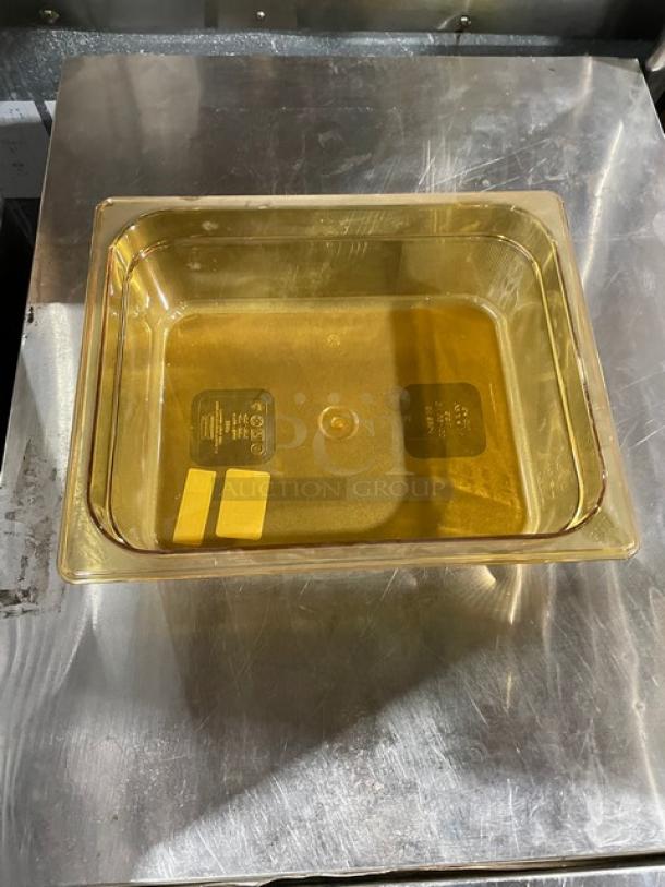 Rubbermaid FG224P00AMBR amber high heat 1/2-size food pan, 4" deep, new condition, durable plastic, visible branding.