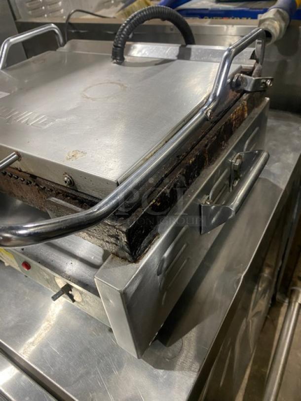 Waring Commercial WPG250 stainless steel panini press grill, used condition, electric powered, 120V, visible wear.