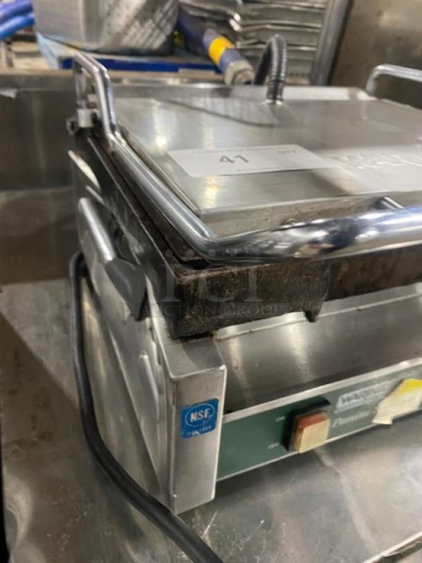 Waring Commercial WPG250 Panini Press Grill, stainless steel, electric, NSF certified, visible wear, model and serial number labels present.