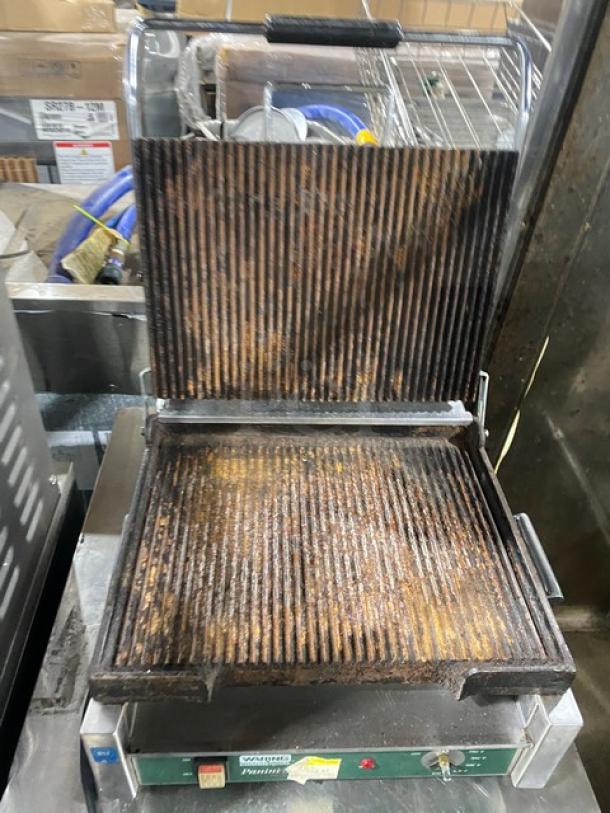 Waring Commercial WPG250 Panini Press Grill, stainless steel, electric, 120V, used condition with visible grill marks.