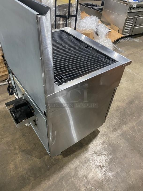 Imperial gas-powered char broiler range/oven combo with backsplash, stainless steel, on casters, includes wired oven rack.