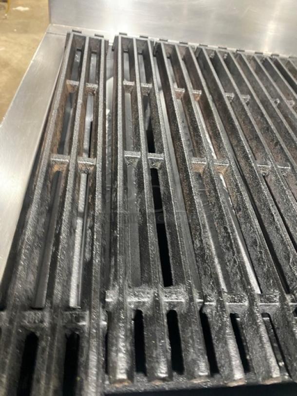 Imperial stainless steel gas char broiler range/oven, radiant design, backsplash, casters, wired oven rack, excellent condition.