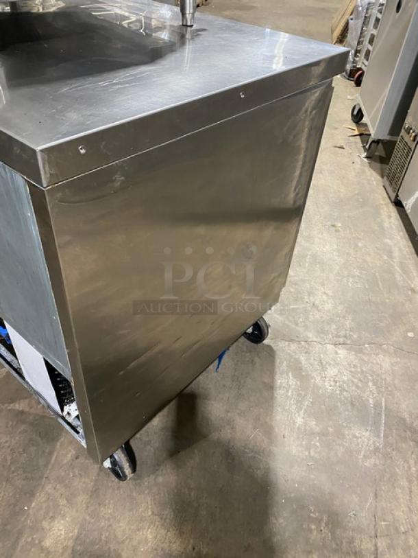 Commercial stainless steel 2-door refrigerated lowboy worktop cooler with poly-coated rack and casters, in good condition.