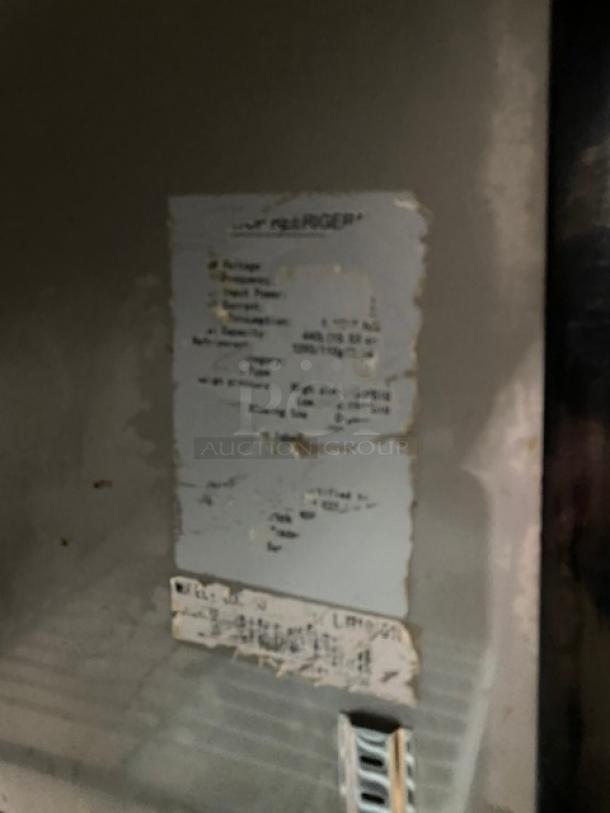 Commercial stainless steel 2-door refrigerated lowboy cooler, features poly-coated wired rack, on casters, visible labels.