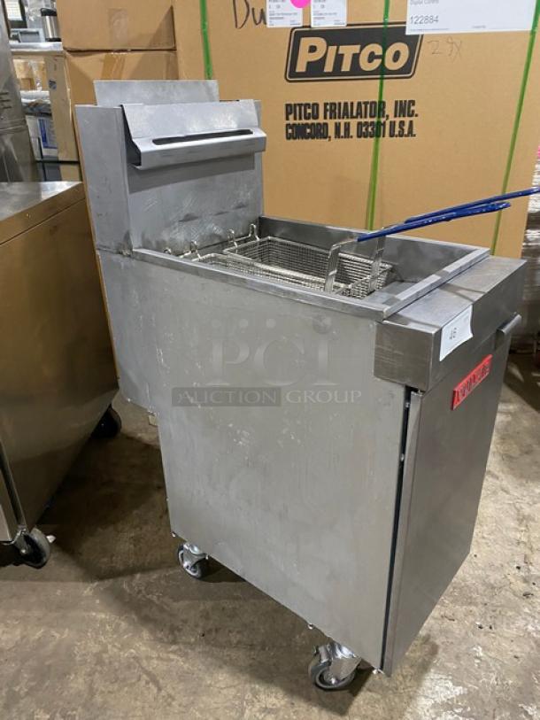 Vulcan LG400 stainless steel deep fat fryer with back splash, basket hanger, and fry baskets. Natural gas, on casters. SN: DV-1070003HB.