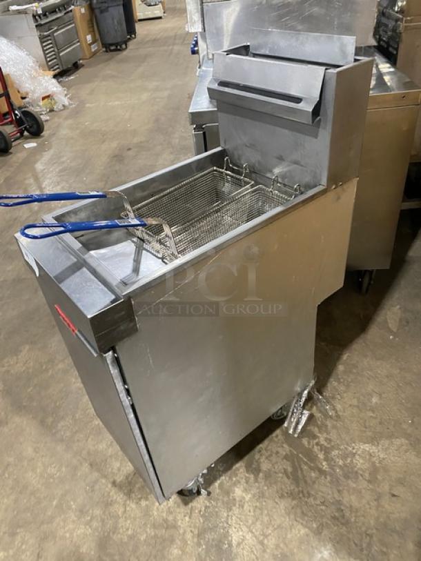 Vulcan LG400 commercial stainless steel natural gas fryer with backsplash, basket hanger, fry baskets, and casters. SN: DV-1070003HB.