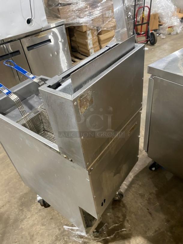 Vulcan LG400 stainless steel deep fat fryer with back splash, basket hanger, fry baskets, and casters. Natural gas powered.