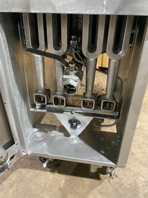 Vulcan LG400 commercial stainless steel natural gas fryer internals; burners and connections visible; on casters.