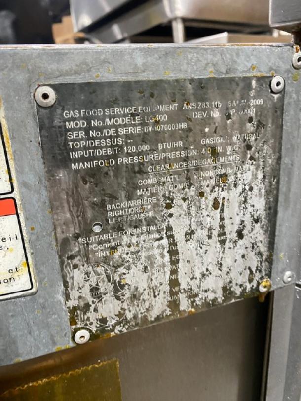 Vulcan LG400 stainless steel deep fat fryer, natural gas, with backsplash, basket hanger, and fry baskets. Model: LG400 SN: DV-1070003HB.