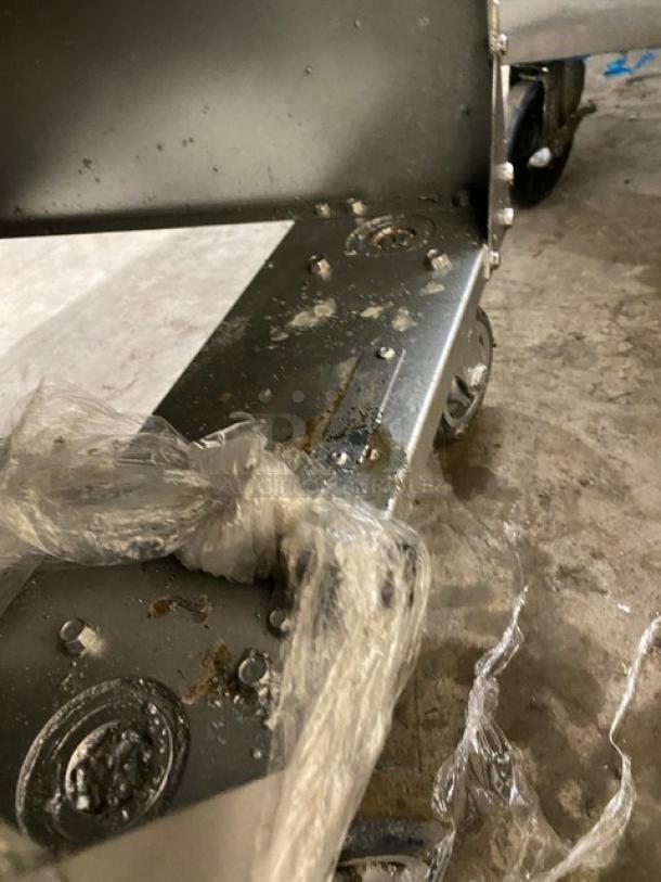 Vulcan LG400 stainless steel deep fat fryer base shown; features casters for mobility. Plastic wrap partially visible.