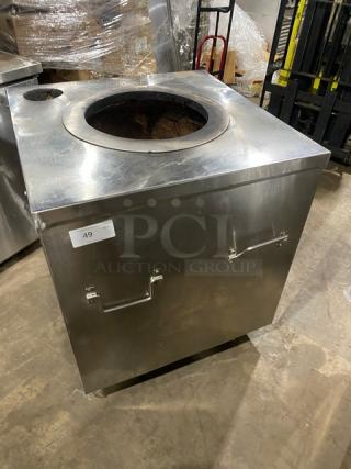 Commercial stainless steel tandoor oven, natural gas powered, on casters, excellent condition, labeled as item 49.