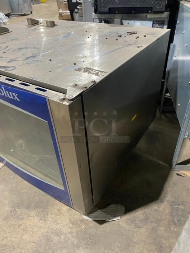 Electrolux Air-O-Convect combi oven, model AOS062GKP1, in stainless steel, natural gas, with touch controls and wired rack.