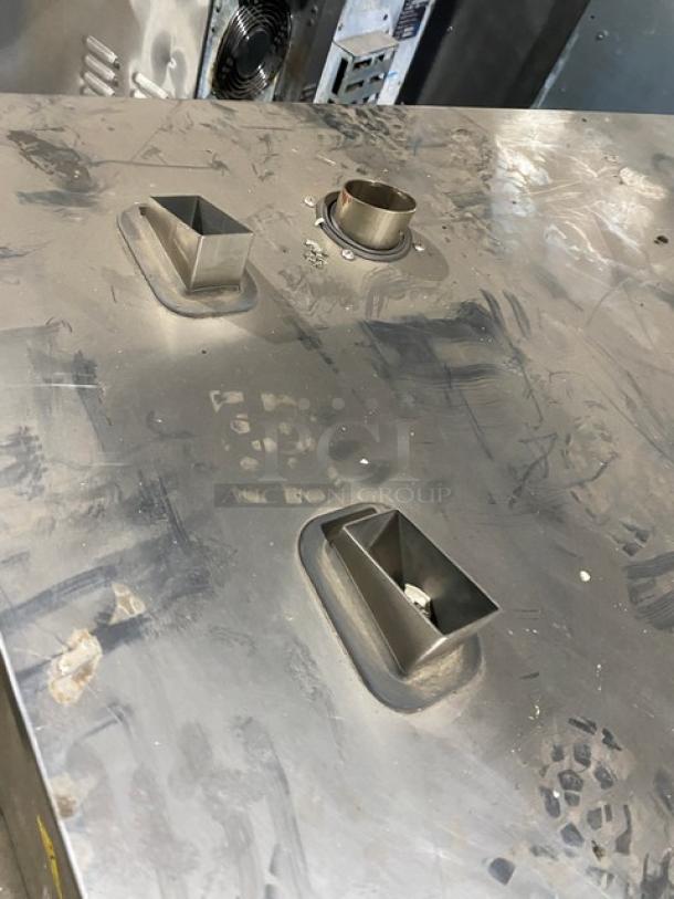 Stainless steel surface of Electrolux Air-O-Convect combi oven model AOS062GKP1, showing gas outlets and wired rack connectors.