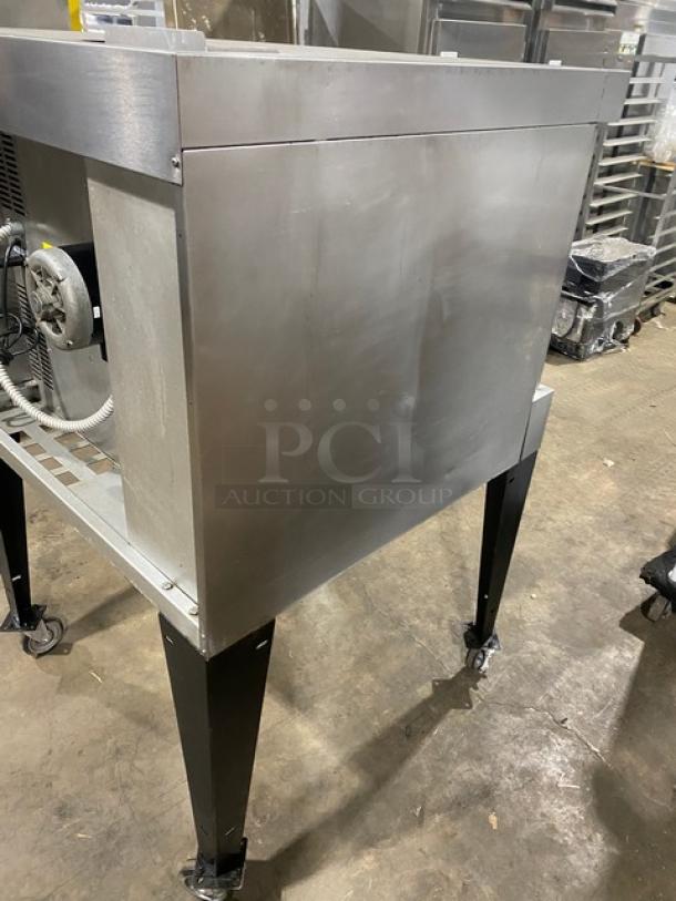 Bakers Pride Cyclone Series stainless steel gas convection oven, single stack, with wired oven rack, on casters.