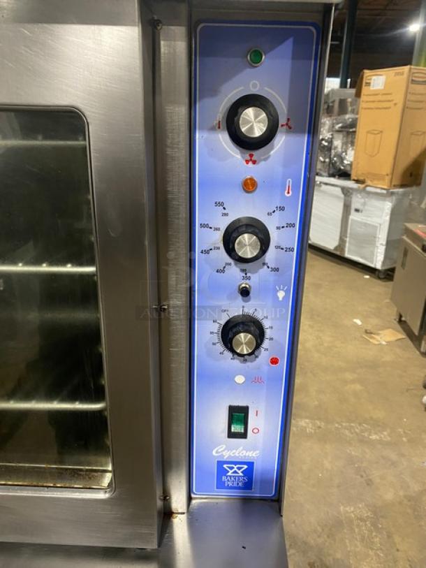 Bakers Pride Cyclone Series stainless steel gas convection oven, single stack, with wired rack, on casters, control panel view.