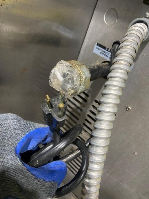 Bakers Pride Cyclone Series convection oven plug and wiring details, showing gas connection and power cord condition.