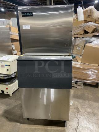 Ice-O-Matic ICE1006HA4 stainless steel air-cooled half cube ice machine with bin, 208-230V, on legs, model and serial number visible.