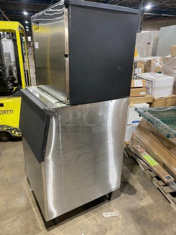 Ice-O-Matic ICE1006HA4 commercial ice machine, stainless steel, air-cooled, half cube, electric, on legs, model label visible.