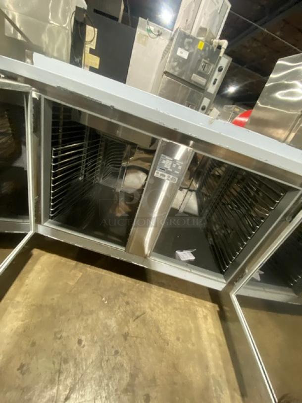 Custom Cool stainless steel 3-door refrigerated worktop table, Model LB93, with up-turned backsplash, built-in pan rack, 115V, on casters.