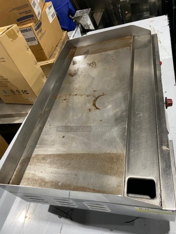 Cecilware EL1636 commercial stainless steel 36" flat griddle, thermostatic control, back and side splash, 240V, on legs.