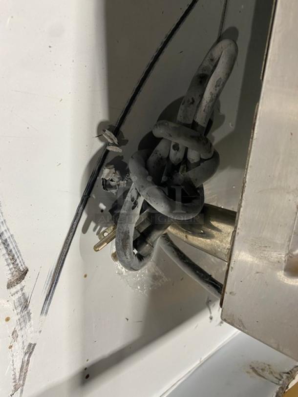 Cecilware EL1636 electric griddle cord and plug. Visible wear and mounting hardware. Model info not shown.