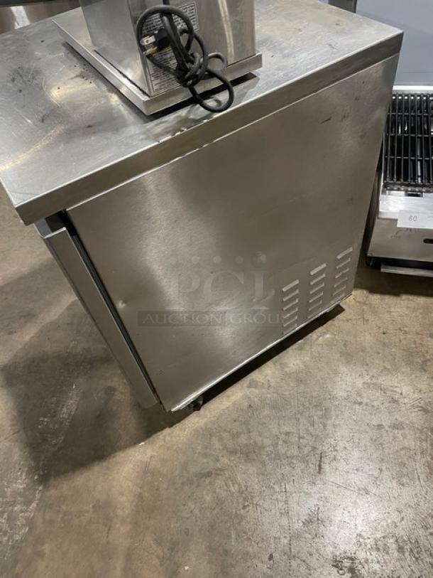 Fagor FUR-27 undercounter stainless steel refrigerator on casters, with poly-coated wired rack, model SN 07070051M, 115V, 1 phase.