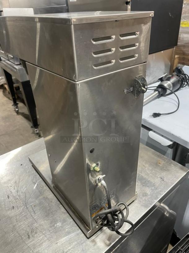 Bunn AXIOM Series stainless steel automatic coffee brewer with hot water dispenser and digital controls. Model: AXIOM-DV-APS.