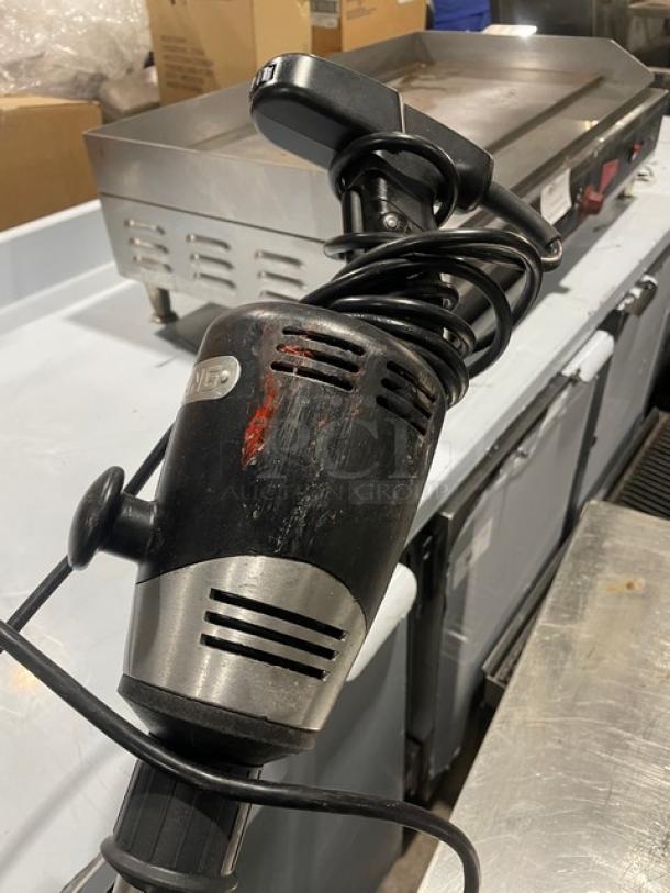 Waring Commercial Handheld Immersion Blender WSB, 120V. Visible wear on the handle. Coiled cord. Used condition.