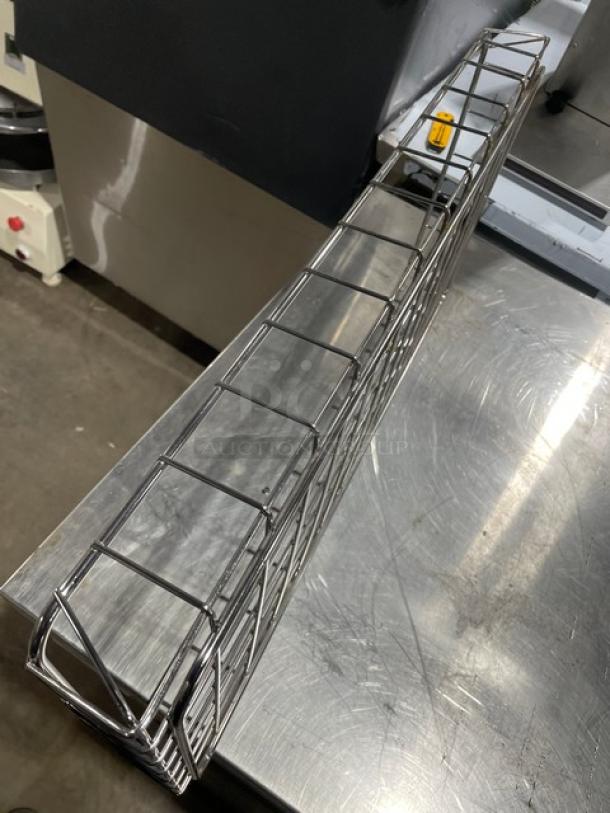 Commercial chrome-plated full-size bagel/pastry wired rack, excellent condition, sturdy design for professional use.