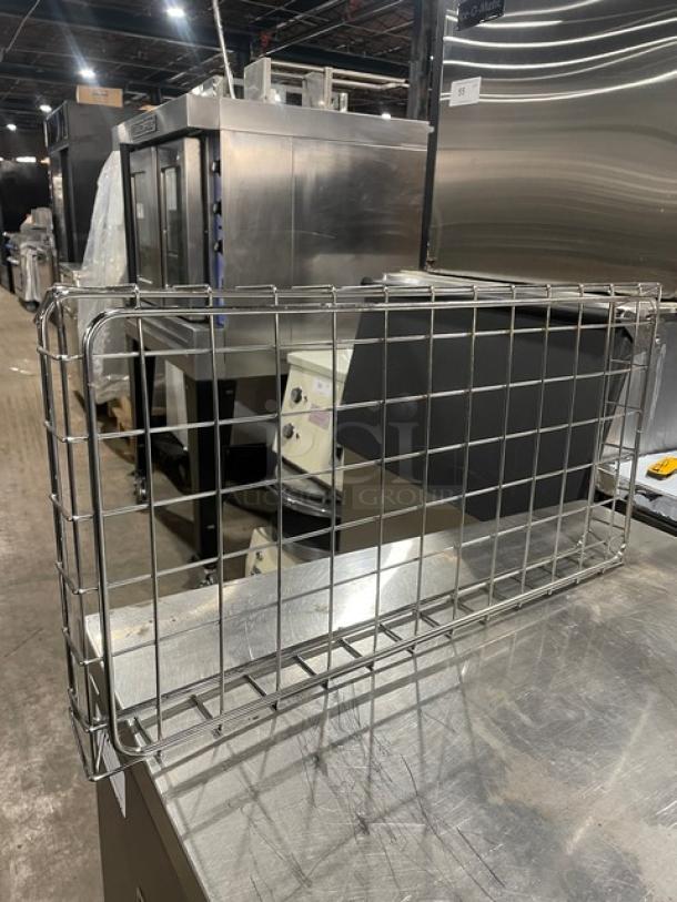 Chrome-plated wired rack for bagels/pastries, full-size, commercial use. Excellent condition. Sturdy with grid design.