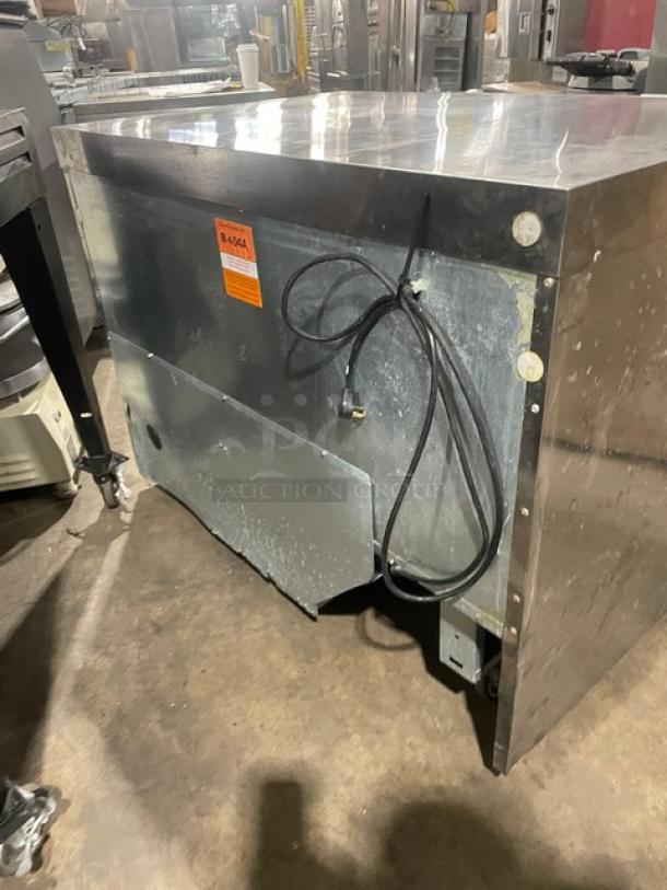 Delfield UC4448NA8 stainless steel undercounter 2-door refrigerated lowboy with poly coated wired rack, on casters, 115V.