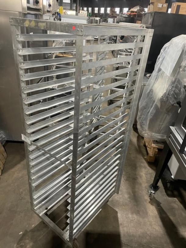Commercial aluminum 20-pan end-load sheet pan rack, sturdy construction, holds 20 pans, used condition, ideal for transport.