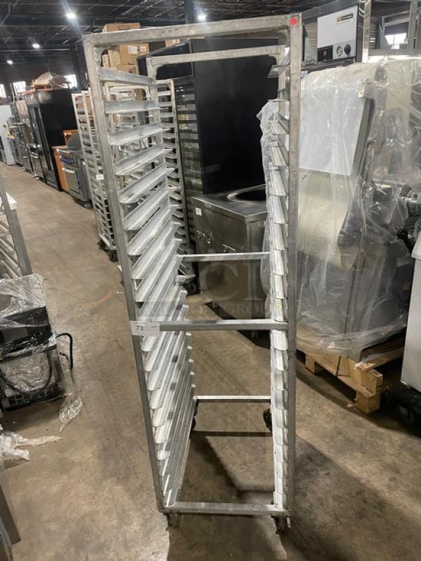 Commercial aluminum 20-pan end-load sheet pan rack in good condition, visible ID tag "73," ideal for holding and transport.